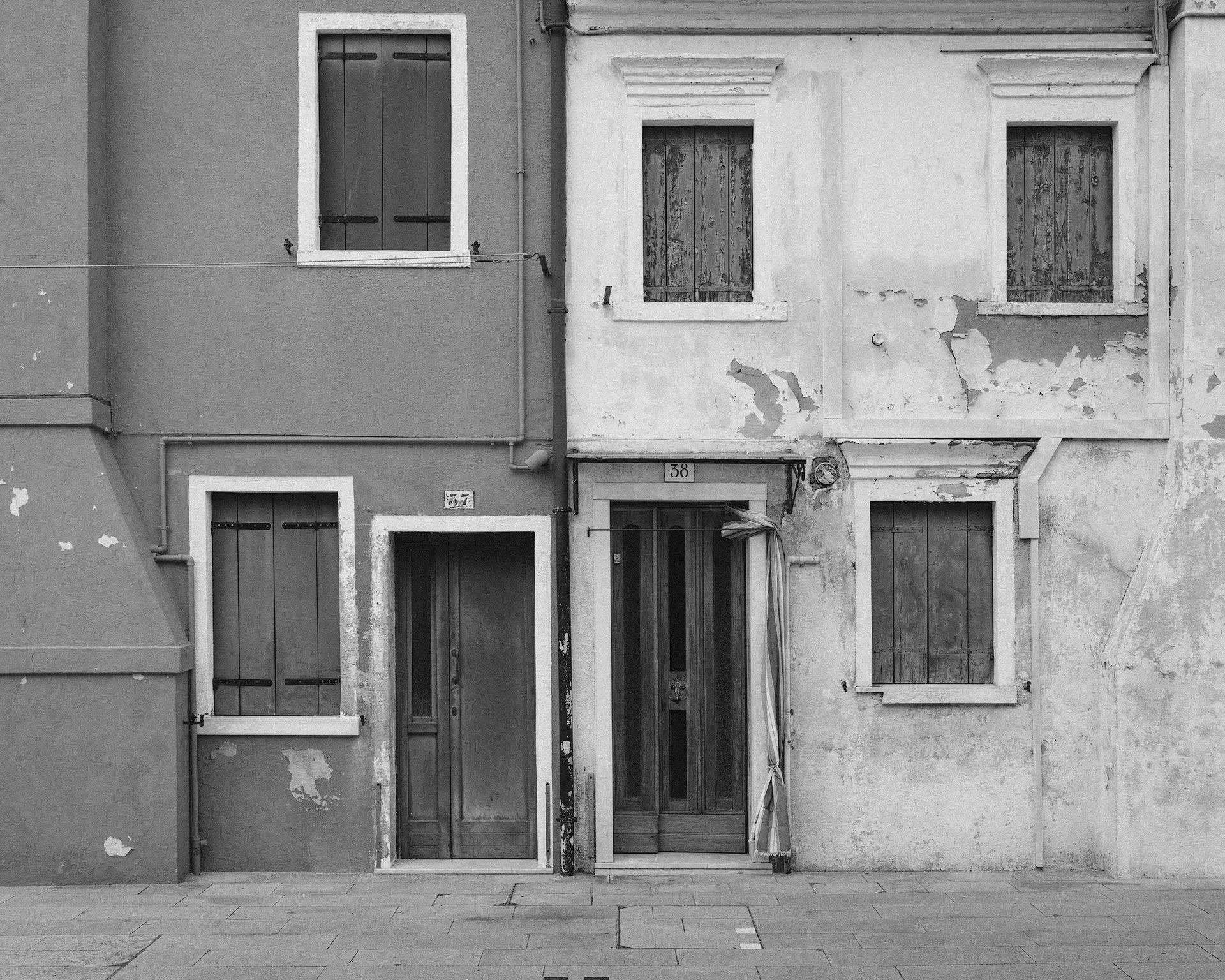 Black and white photo of homes in Burano, Italy